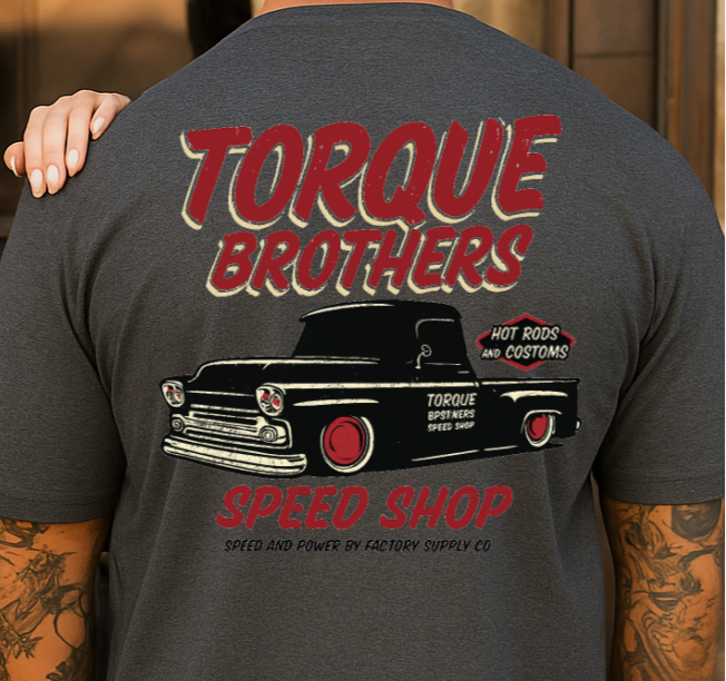Two people wearing Torque Brothers t-shirts with a truck graphic on the back.