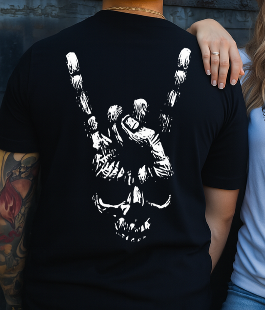 Two people wearing t-shirts with skeleton hand designs, one black and one white, against a dark background.