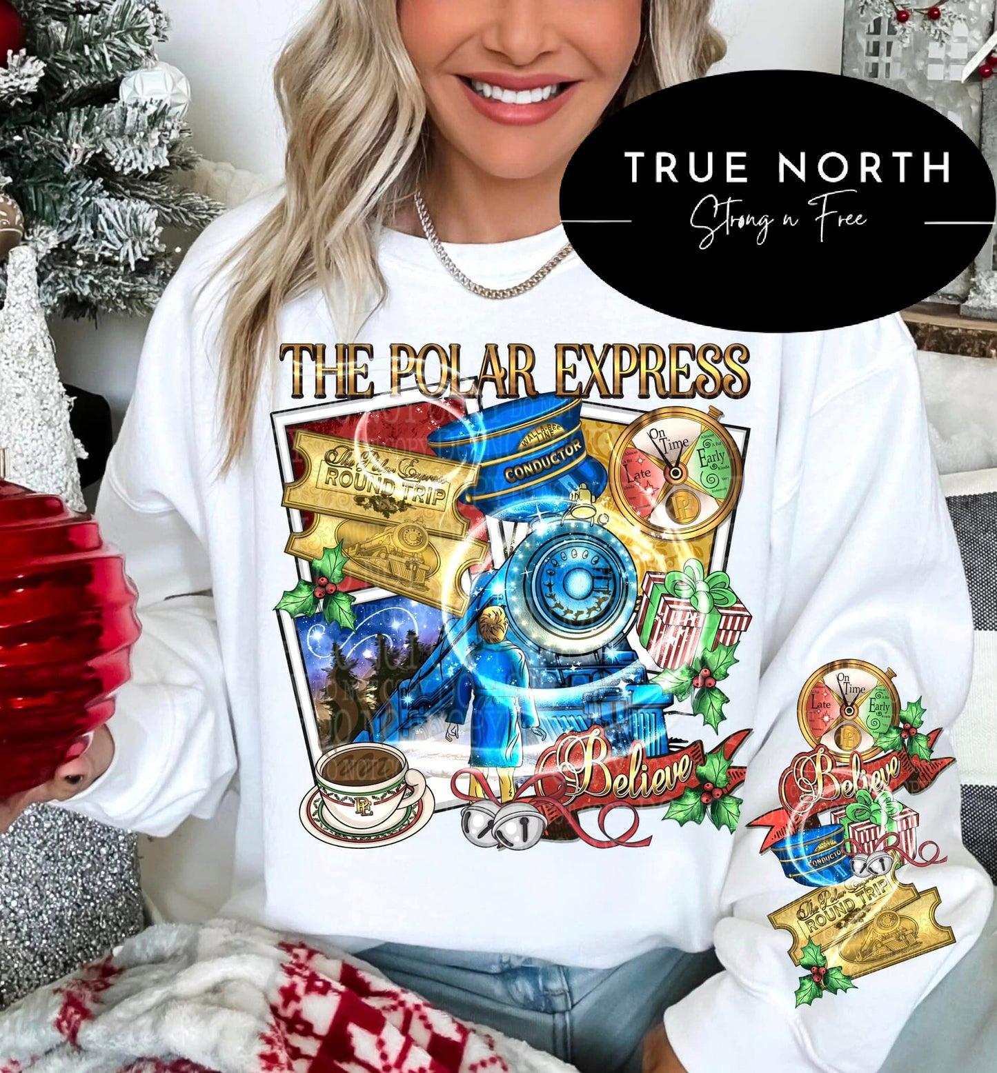A person wearing a white sweatshirt with a 'Polar Express' themed graphic print.