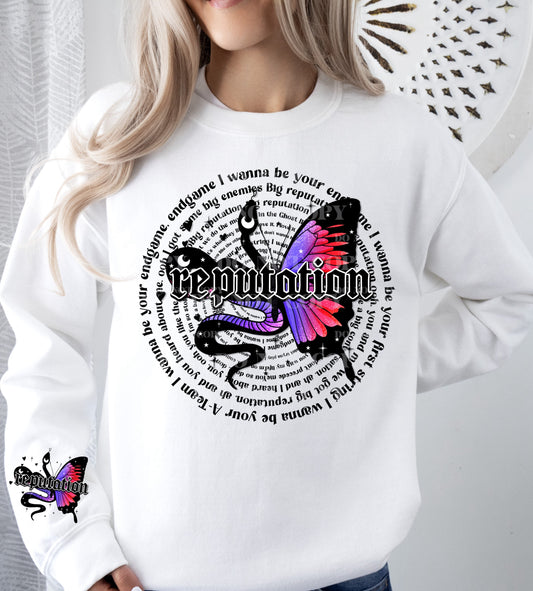 a woman wearing a white sweatshirt with a butterfly on it