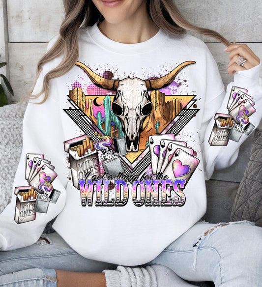 a woman wearing a white sweatshirt with a bull skull on it