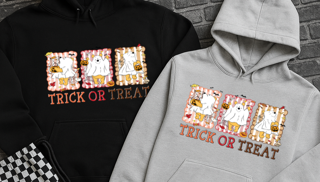 Black and gray hoodies with 'Trick or Treat' design on a brick background