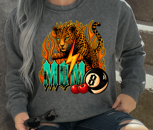 Person wearing a gray sweatshirt with a colorful graphic design, sitting on steps.