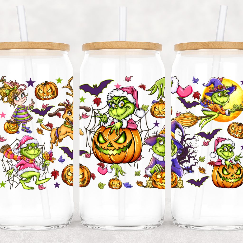 Three glass tumblers with Halloween-themed designs featuring cartoon characters and pumpkins.
