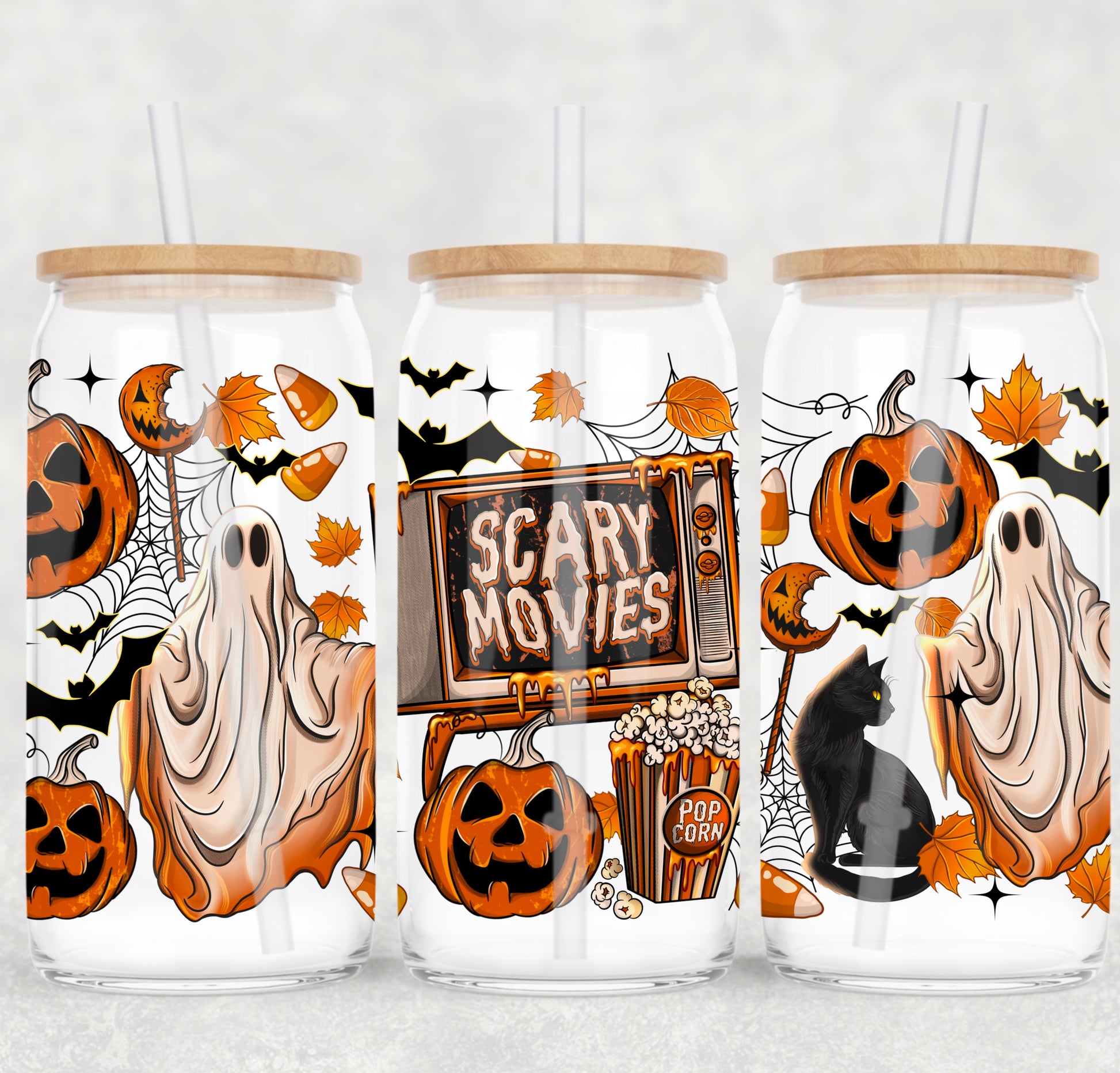 Three Halloween-themed glass jars with wooden lids on a white background