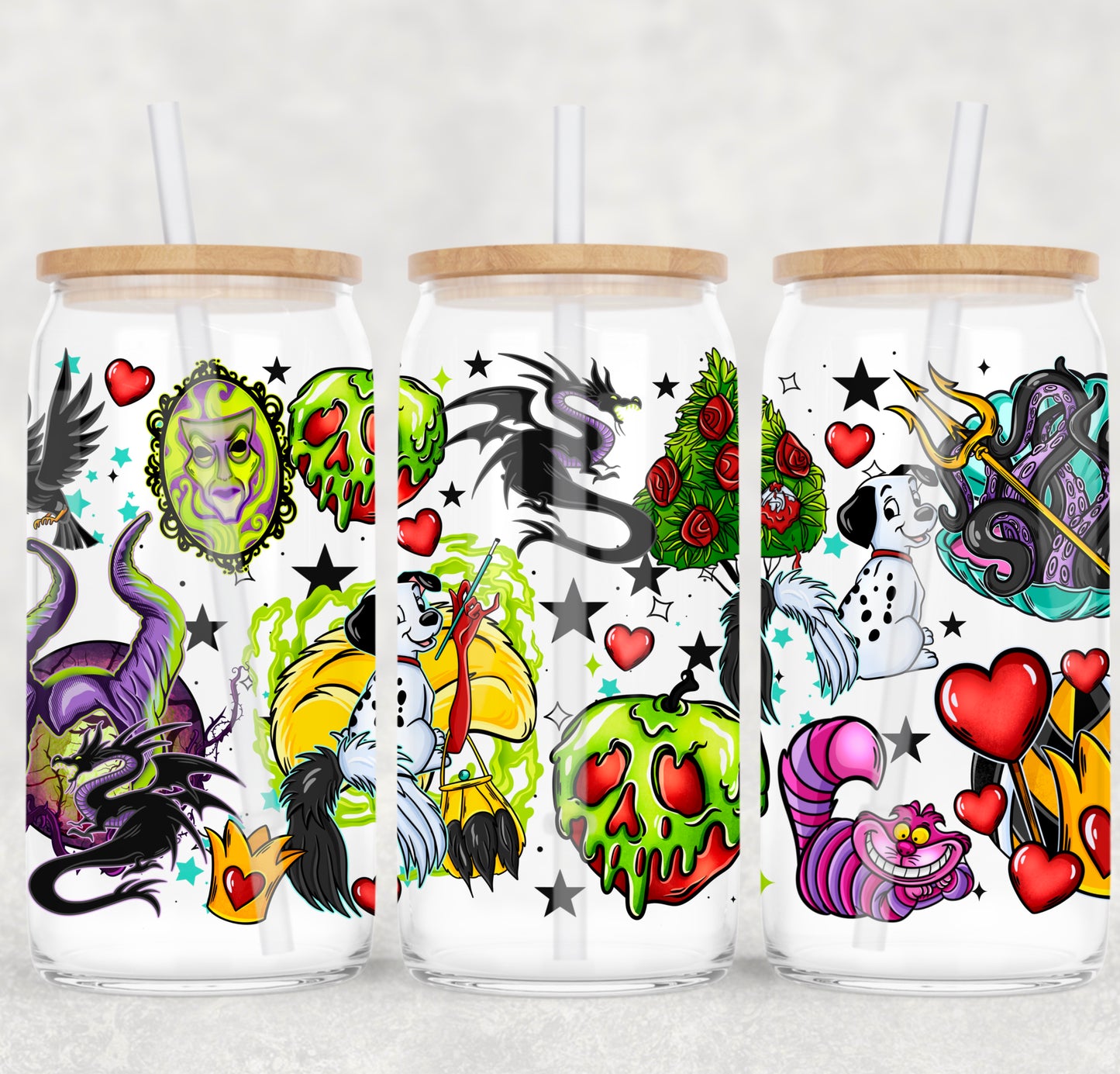 Three glass tumblers with colorful designs featuring cartoon characters and tattoos on a white background.