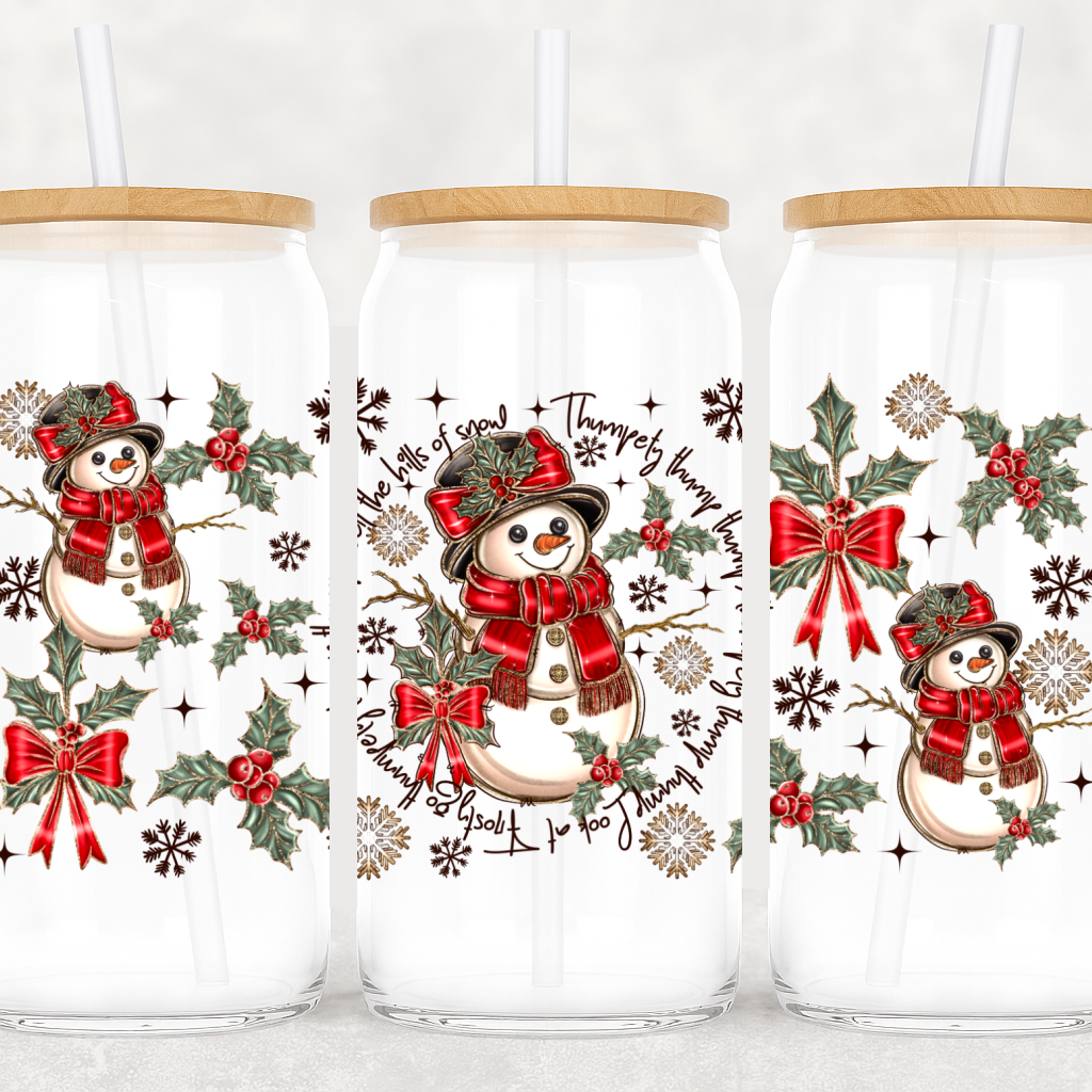 Three glass tumblers with snowman designs and Christmas elements on a white background