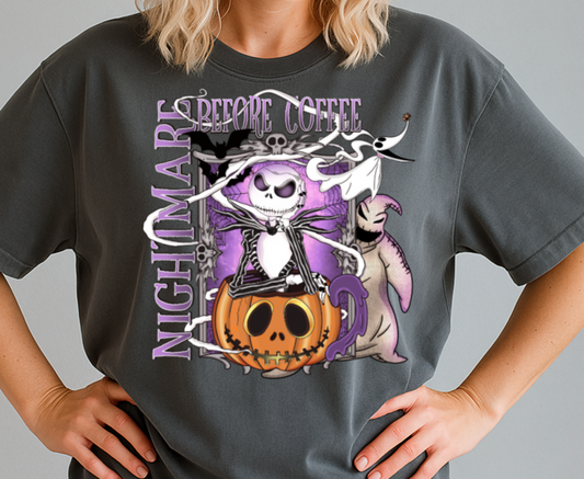 Person wearing a dark gray t-shirt with a Halloween-themed design, black cap, and sunglasses on a plain background.