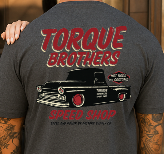 Two people wearing Torque Brothers t-shirts with a truck graphic on the back.
