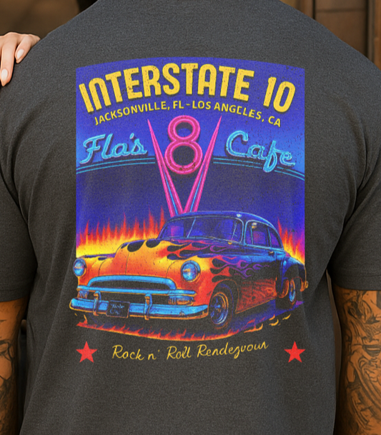 Two people wearing t-shirts with a colorful graphic design of a classic car and text.