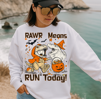 Person wearing a white sweatshirt with a graphic design by a body of water.