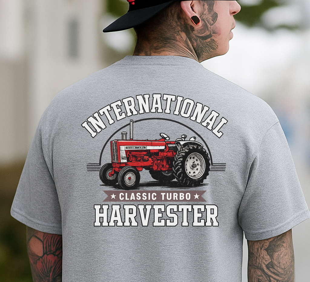 Person wearing a gray t-shirt with International Harvester logo on the back.