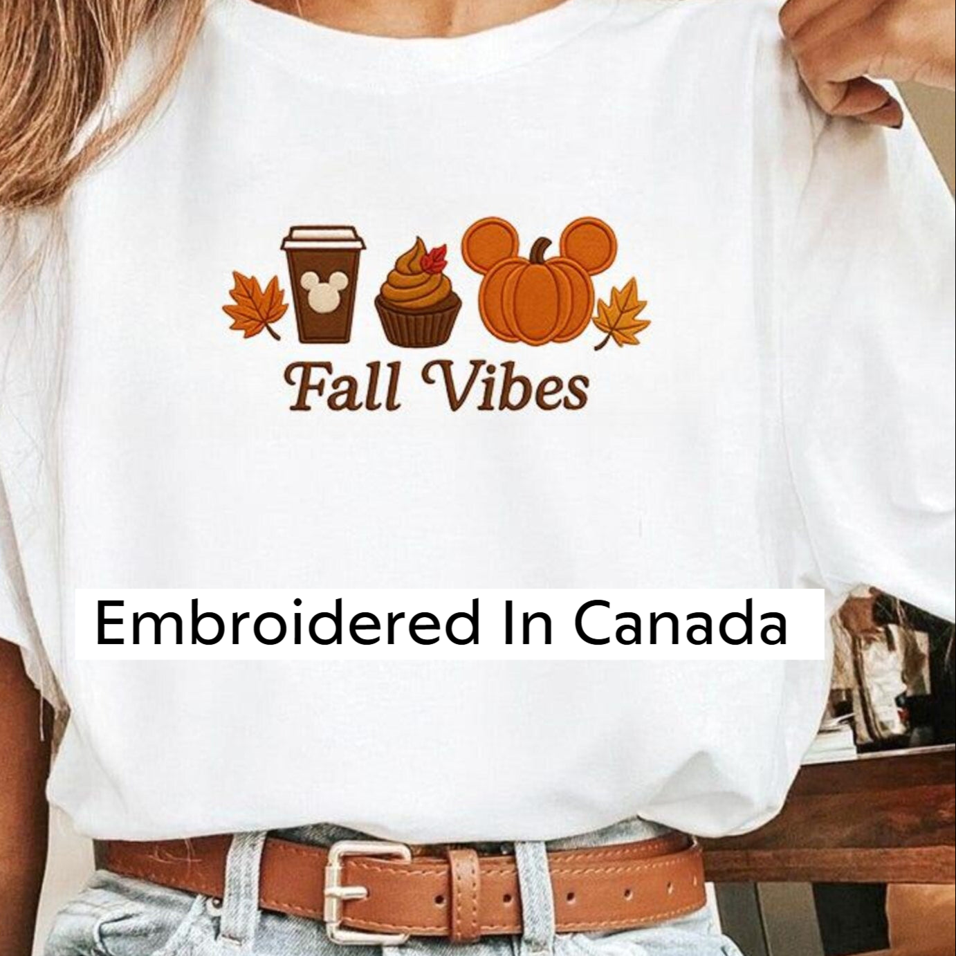 White t-shirt with 'Fall Vibes' design featuring a coffee cup, cupcake, and pumpkin.