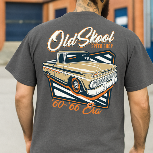 Person wearing a gray t-shirt with a graphic of a vintage truck and 'Old School Speed Shop' text.