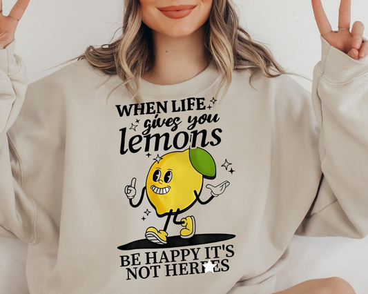 a woman wearing a sweatshirt that says when life gives you lemons be happy it