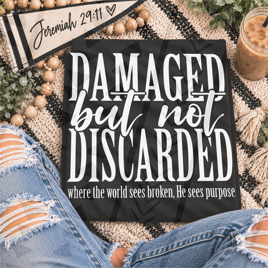 Damaged but Not Discarded – garment mockup showing the transfer design; garment not included