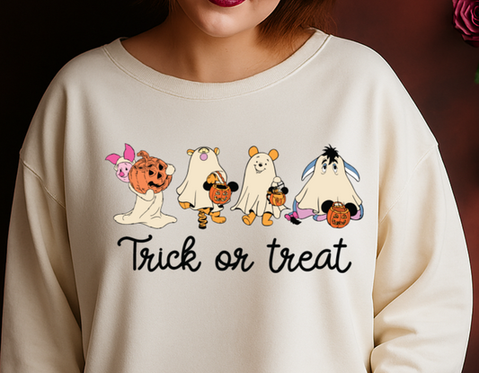 Woman wearing a cream-colored sweatshirt with cartoon dogs and 'Trick or Treat' text, standing against a dark background with flowers.