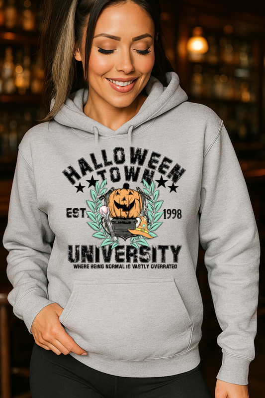 Woman wearing a gray hoodie with 'Halloween Town University' design in a bar setting