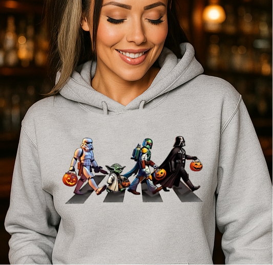 Woman wearing a hoodie with a unique design in a bar setting