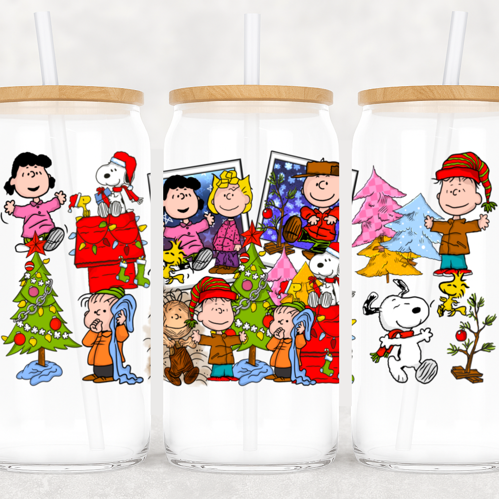 Three glass tumblers with Christmas-themed illustrations featuring characters and festive elements.