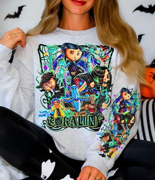 Person wearing a sweatshirt with 'Coraline' character design on a Halloween-themed background