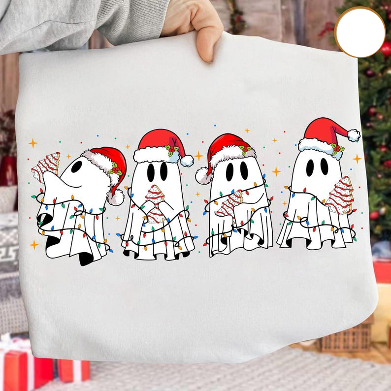 White pillow with Christmas-themed ghost design held by a person, with a blurred festive background.