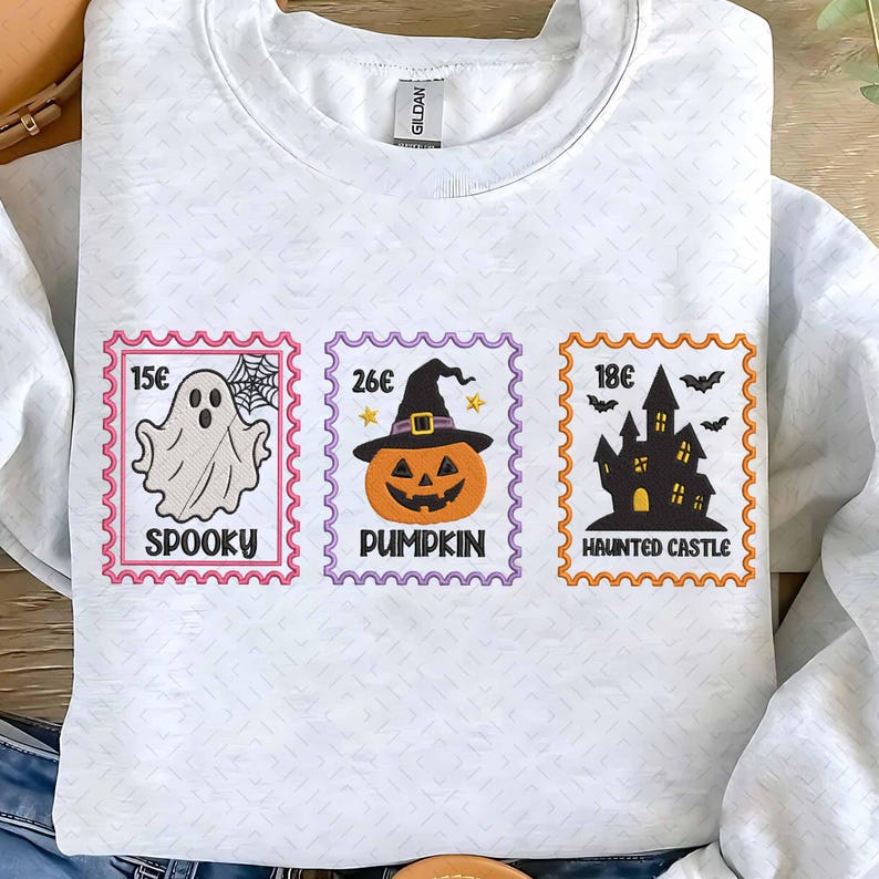 White embroidered Halloween sweatshirt with ghost, pumpkin and haunted castle stamps