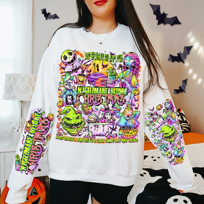 Person wearing a white sweatshirt with colorful ' design, surrounded by Halloween decorations.
