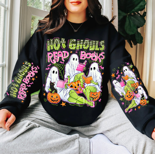 Person wearing a black hoodie with Halloween-themed design featuring ghosts and text.