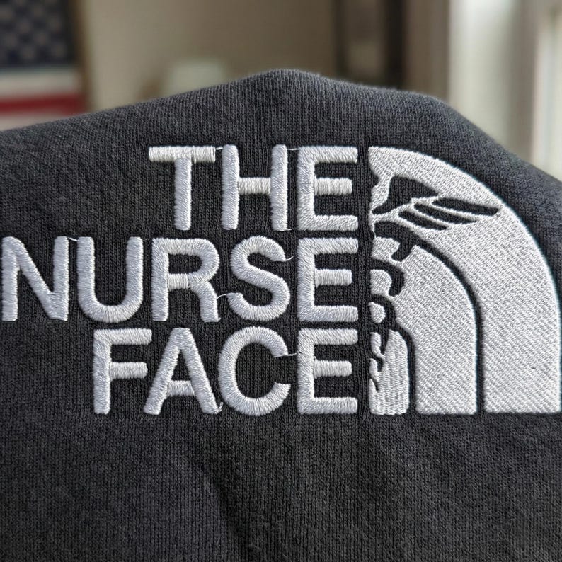Embroidered “The Nurse Face” Cozy Crewneck