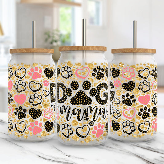 Three tumblers with paw print designs and 'Dog Mom' text on a marble surface.