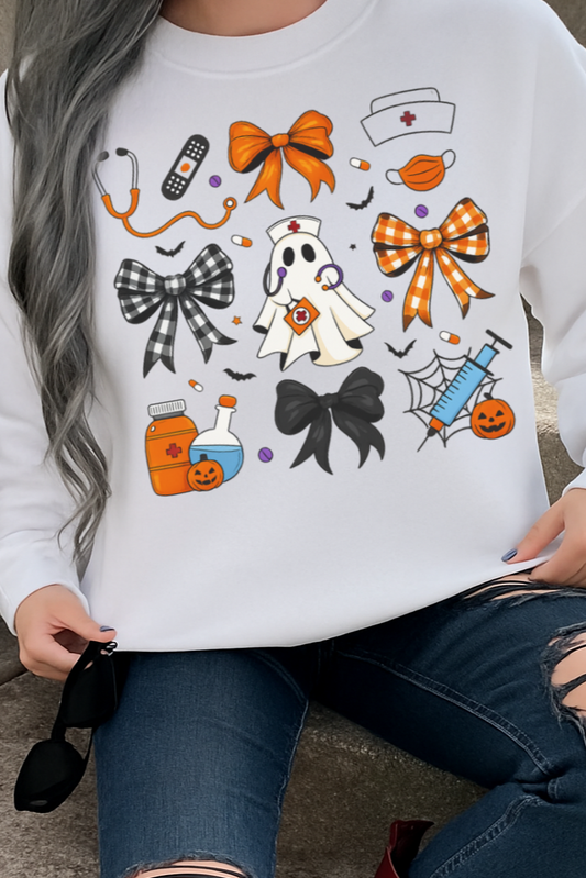 White sweatshirt with Halloween-themed graphics worn by a person.