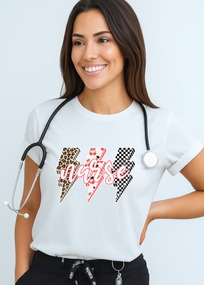 Woman wearing a white t-shirt with colorful designs and text, standing against a light blue background.