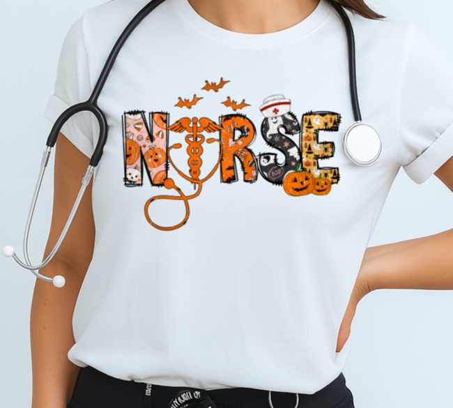 Woman wearing a white t-shirt with 'NURSE' and Halloween-themed design, stethoscope around neck, on a light blue background.