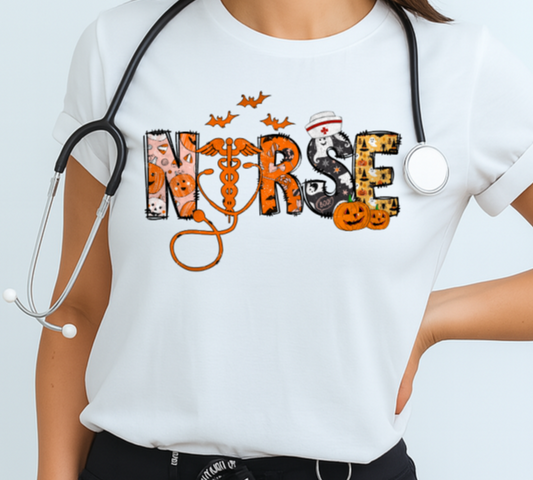 Woman wearing a white t-shirt with 'NURSE' and Halloween-themed design, stethoscope around neck, on a light blue background.