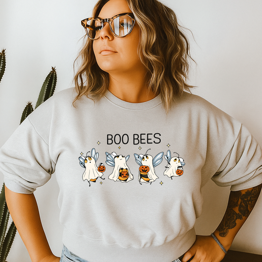 Person wearing a light gray sweatshirt with 'BOO BEES' and ghost illustrations.