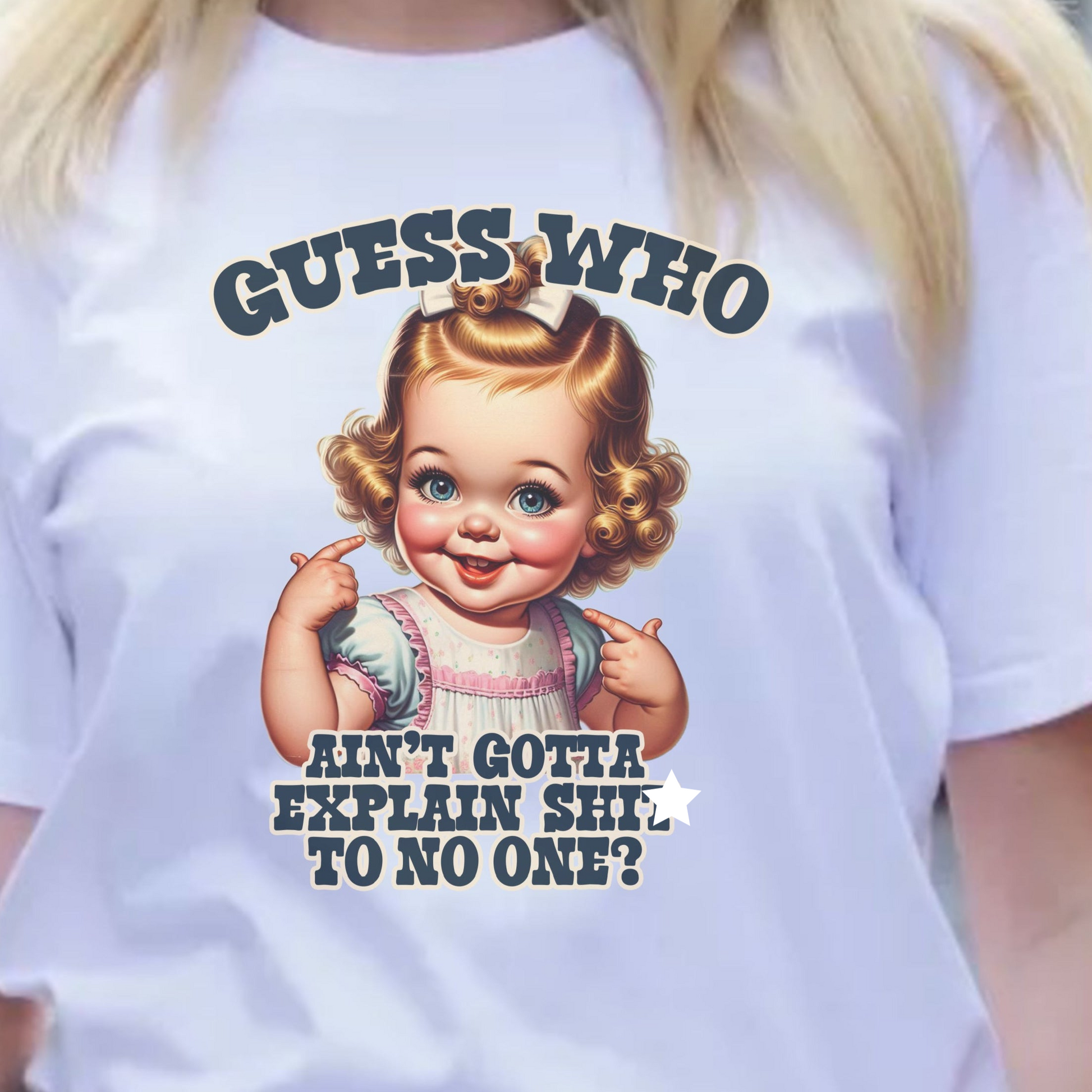 a woman wearing a white t - shirt with a picture of a baby doll on