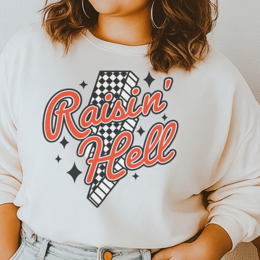 DTF Transfer Raisin’ Hell – Retro Red Script with Checker Lightning Bolt & Star Accents