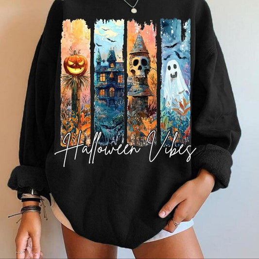 Black sweatshirt with Halloween-themed design and 'Halloween Vibes' text on a neutral background