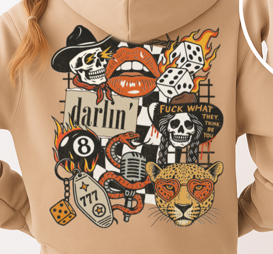 Beige hoodie with colorful graphic designs on the back, worn by a person.