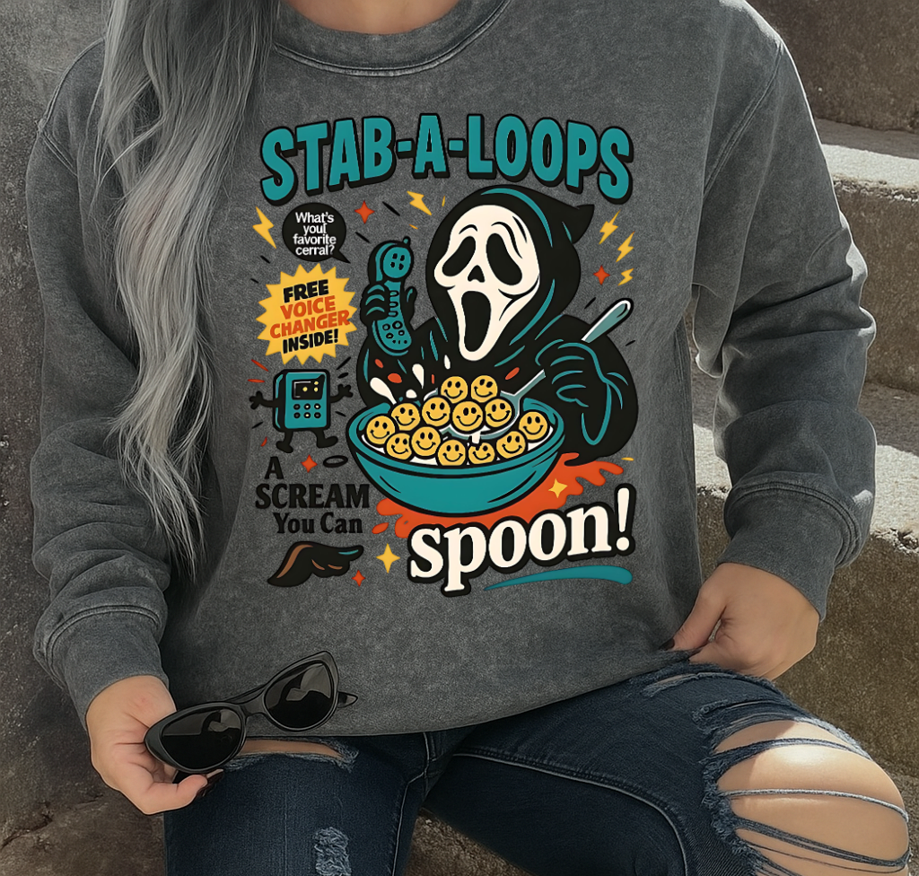 Person wearing a gray sweatshirt with a graphic design sitting on steps.
