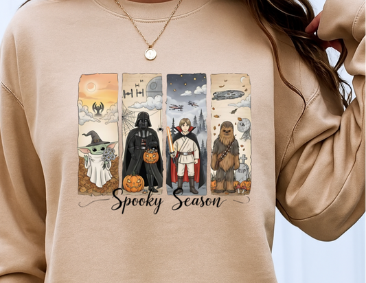 Beige sweatshirt with Halloween-themed graphic and 'Spooky Season' text on a plain background