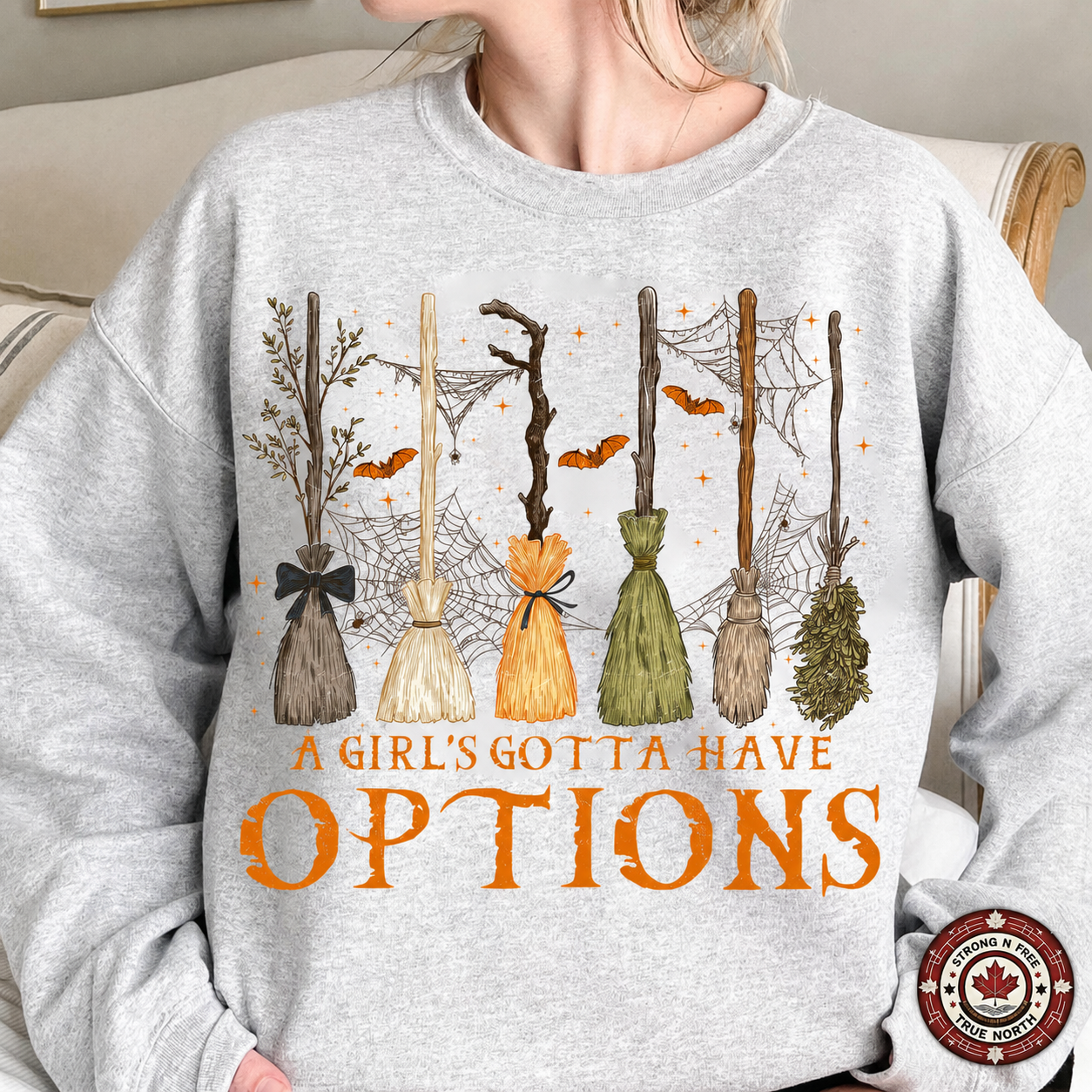 A Girl's Gotta Have Options DTF transfer on a gray sweatshirt