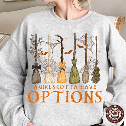 A Girl's Gotta Have Options DTF transfer on a gray sweatshirt
