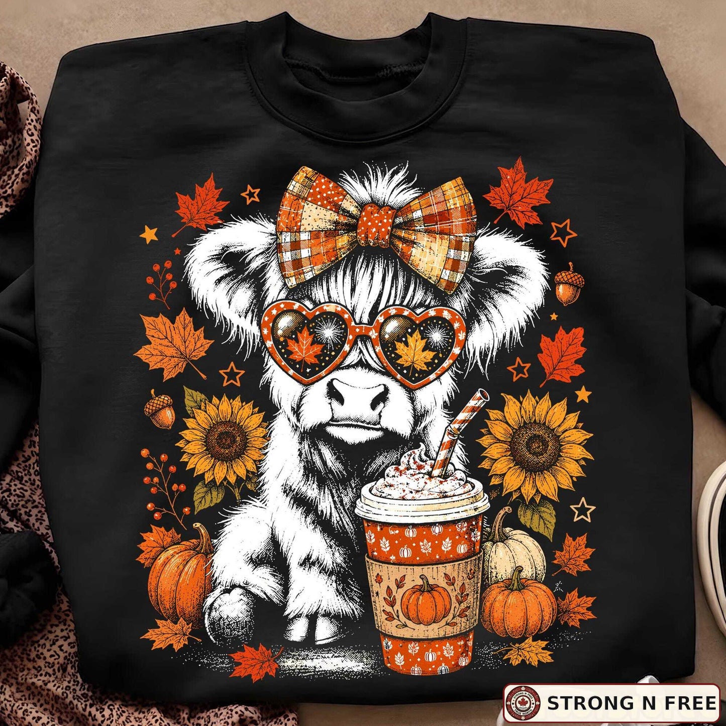 Retro Highland cow autumn DTF transfer on a black sweatshirt