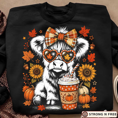 Retro Highland cow autumn DTF transfer on a black sweatshirt