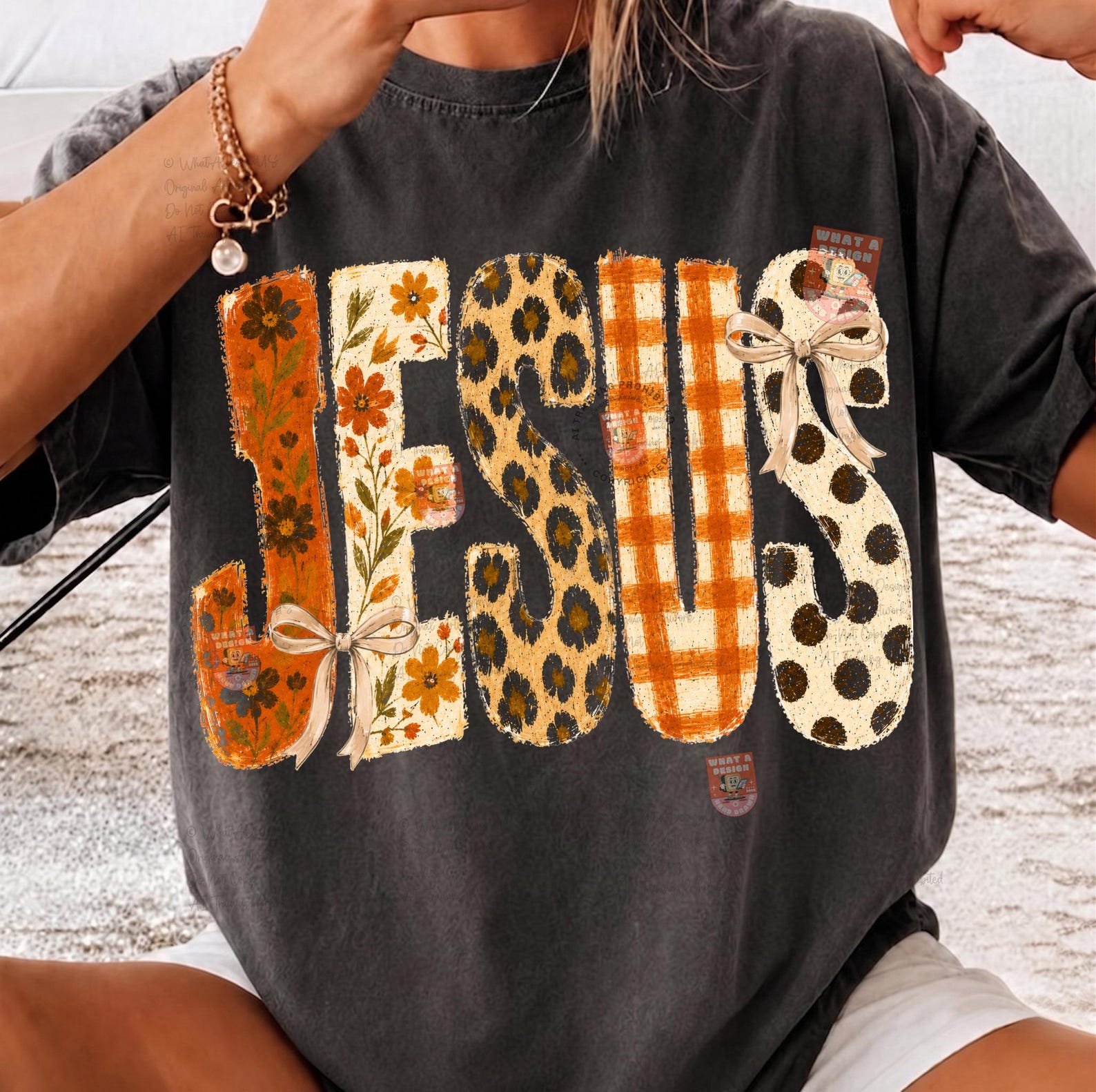 Jesus autumn patterned-letter DTF transfer shown on a charcoal T-shirt
