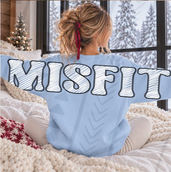 MISFIT white sketch lettering with black outline across the back and sleeves of a blue sweatshirt; DTF transfer only