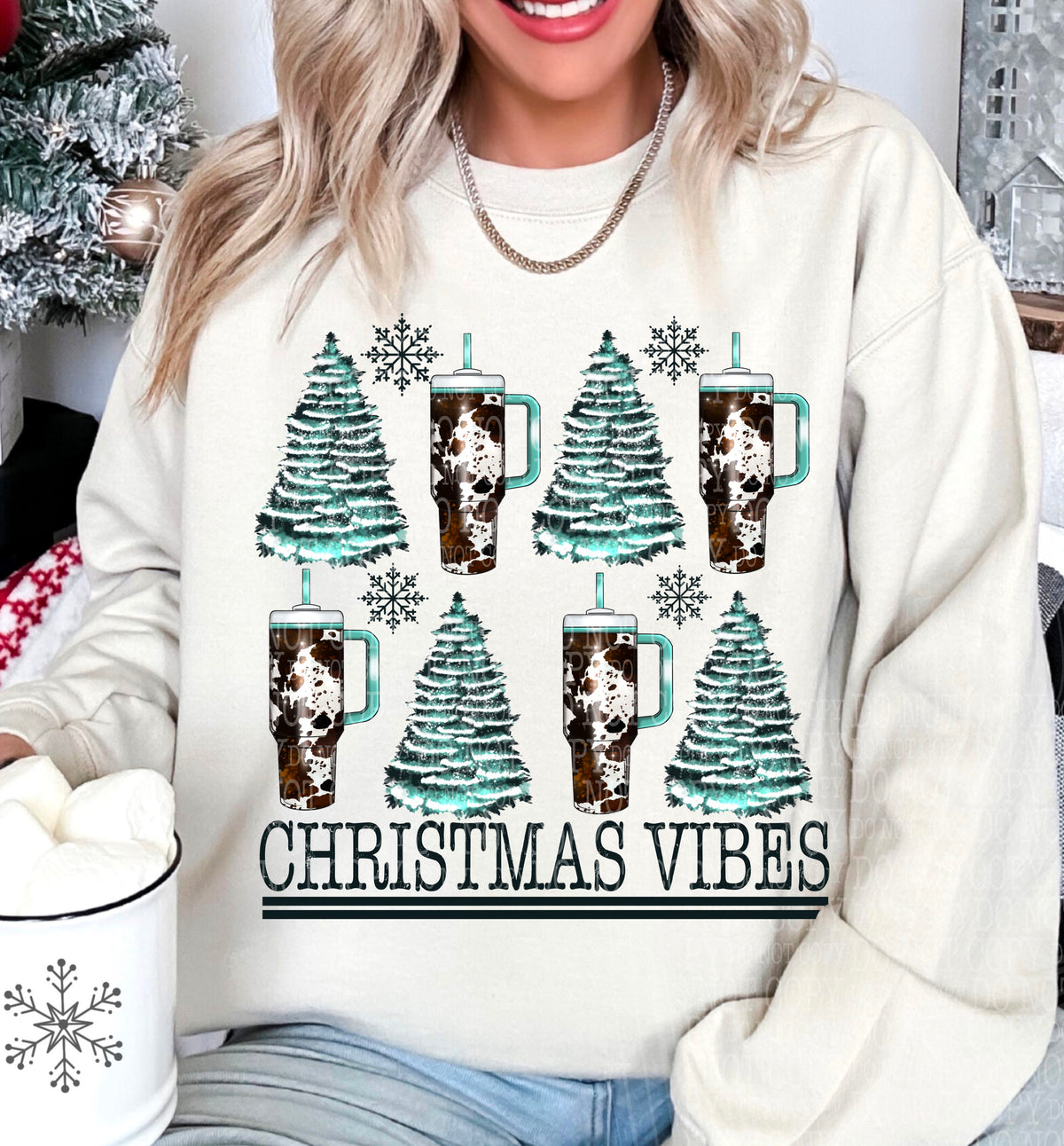 Christmas Vibes – Teal Trees and Cow Print Tumblers DTF transfer shown on a garment