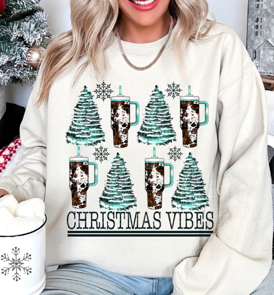 Christmas Vibes – Teal Trees and Cow Print Tumblers DTF transfer shown on a garment